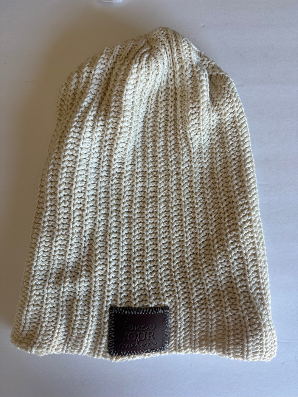 Love Your Melon Cream Knit slouchy Beanie with Leather Patch